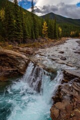 Waterfall In The Fall Mountains Of Alberta