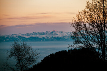sunset over the snow-capped mountains