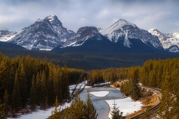 River Flowing Through The Banff Mountains In Winter