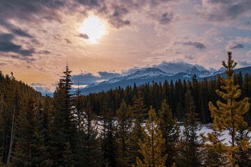 Cloudy Sunrise Over Mountains And Forest