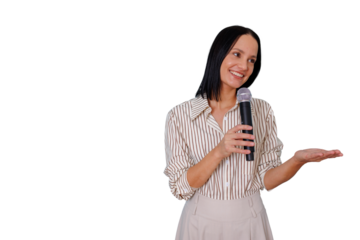 Confident female speaker holding a microphone and gesturing, presenting information, giving a lecture or leading a conference