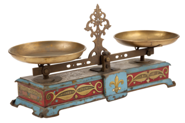 Vintage ornamental balance scale with brass pans and decorative base, a symbol of measurement and equilibrium