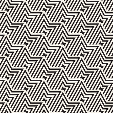 Vector seamless geometric pattern. A geometric pattern featuring alternating zigzag shapes in black lines on a light beige background, creating a visually striking repetitive design.