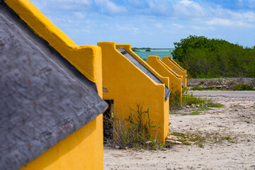 Historic red Slave Huts (Slave Houses) on the Salt Flats Coast of Bonaire in the Dutch Caribbean