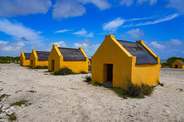 Historic red Slave Huts (Slave Houses) on the Salt Flats Coast of Bonaire in the Dutch Caribbean
