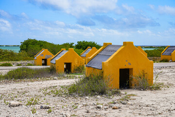 Historic red Slave Huts (Slave Houses) on the Salt Flats Coast of Bonaire in the Dutch Caribbean