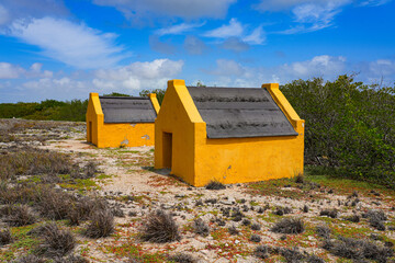 Historic red Slave Huts (Slave Houses) on the Salt Flats Coast of Bonaire in the Dutch Caribbean