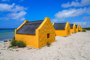 Historic red Slave Huts (Slave Houses) on the Salt Flats Coast of Bonaire in the Dutch Caribbean