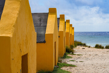 Historic red Slave Huts (Slave Houses) on the Salt Flats Coast of Bonaire in the Dutch Caribbean