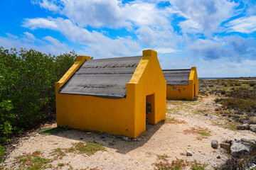 Historic red Slave Huts (Slave Houses) on the Salt Flats Coast of Bonaire in the Dutch Caribbean