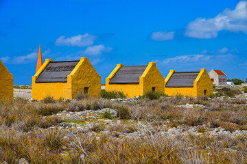 Historic red Slave Huts (Slave Houses) on the Salt Flats Coast of Bonaire in the Dutch Caribbean