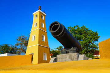 Old cannon on the ramparts of Fort Oranje and Lighthouse in Kralendijk, Bonaire - 17th century...