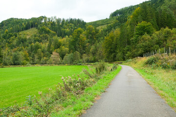 Typical Austrian natural landscape, road in the mountain valley