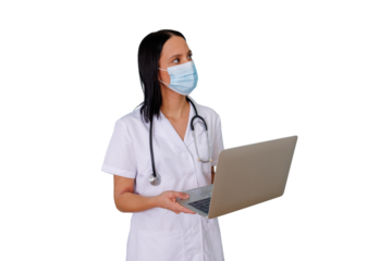 Female healthcare professional wearing face mask and stethoscope, holding and looking up using laptop computer