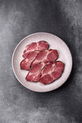 Meat, smoked ham, or pork sausage sliced for breakfast sandwiches. Sliced ham