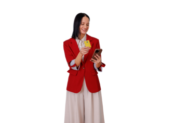 Woman in red jacket holding credit card and smartphone, making online payment, shopping with e-commerce app on transparent background