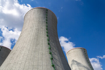 Cooling towers at nuclear power plant, energy self-sufficiency, greenhouse emission reduction and global warming concept