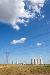 Cooling towers at nuclear power plant, energy self-sufficiency, greenhouse emission reduction and global warming concept