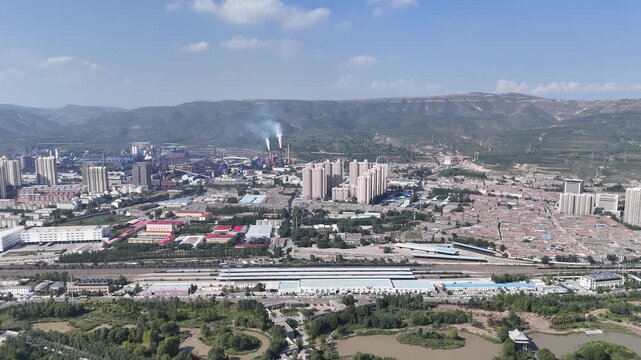 Xining City Aerial Skyline Shot with Industrial Area and Mountains