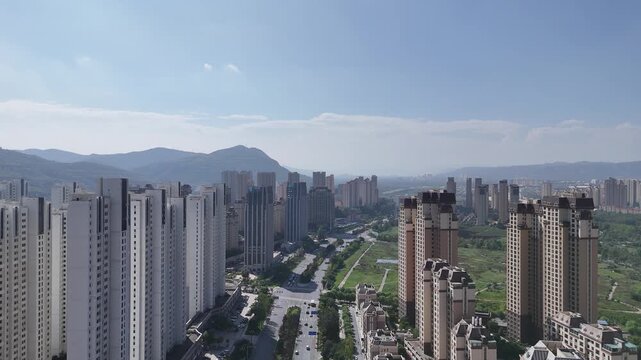 Xining Skyline Aerial Shot - Urban High-Rises and Mountains