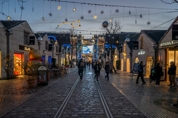 Paris - France,France - 12 16 2025: Paris By Christmas Night. View Saint-Emilion courtyard at Bercy Village decorating for christmas at blue hour