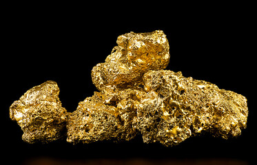 Pile of pure gold from the mine on black background. Gold nuggets. Finance and business concept. © domnitsky
