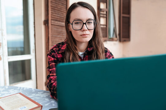 Morning focus as a woman works on her laptop at home
