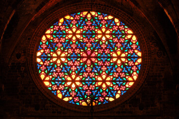 Stained glass rose window in a historic church