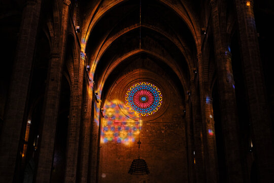 Palma Cathedral rose window creating colorful light patterns