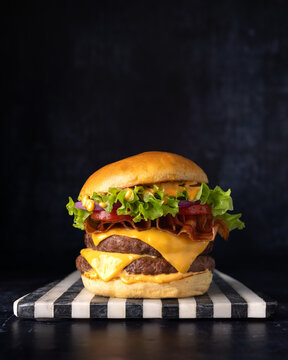 Delicious bacon and cheese hamburger with fresh toppings