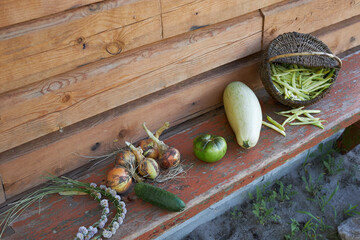 Autumn harvest, vegetables and fruits lie on a wooden table.