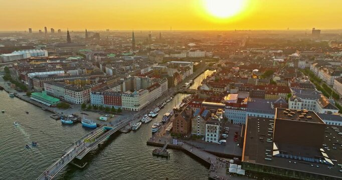 Aerial view of the Nyhavn waterfront in Copenhagen at sunset. One of the city's main attractions, Denmark