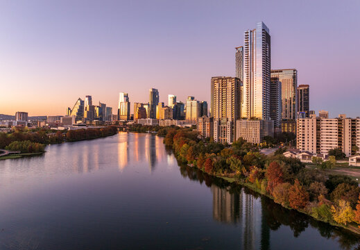 Aerial panoramic skyline of Austin Texas from the east at dusk or sunset in December 2025 with fall colors and clear sky
