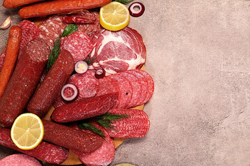 Delicious, aromatic appetizers of various salamis for the holidays. A selection of various smoked...