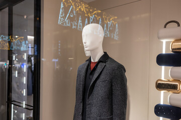 Mannequin displaying menswear in retail store window