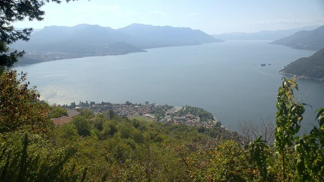 Big Italian lake. Lake Maggiore, aerial view from above Maccagno town (visible below). The Lombard and Piedmontese coasts are visible, from Luino (on the left) to Stresa (on the horizon)