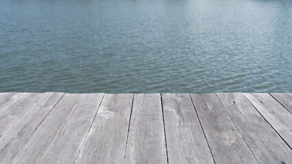 weathered old wooden planks with blue river view