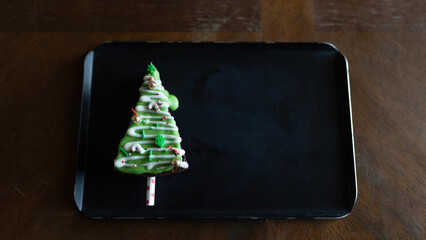 Holiday treat cake on a black plate