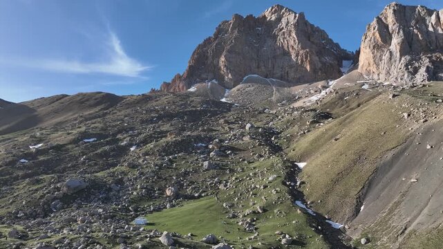 Majestic aerial view of rocky mountain peaks with snow patches in Shahdag National Park, Azerbaijan