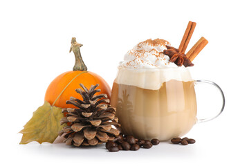Cup of tasty pumpkin coffee with whipped cream, beans, cinnamon sticks, star anise and cone on white background