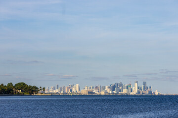 Obraz premium Skyscrapers and condos in the skyline at Matheson Hammock Park at sunset in Coral Gables Florida USA