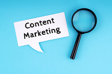 Paper note with text content marketing and magnifying glass