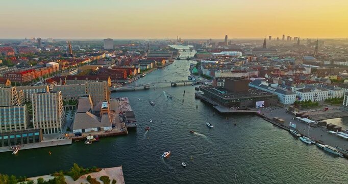 Aerial view of downtown Copenhagen in Denmark atsunset. A view of the embankment and the old part of the city with a church and other landmarks