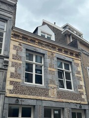 The side of a brick building viewed from the street