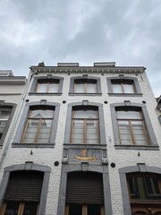 The side of a brick building viewed from the street