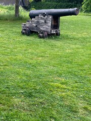 A cannon on a grass field