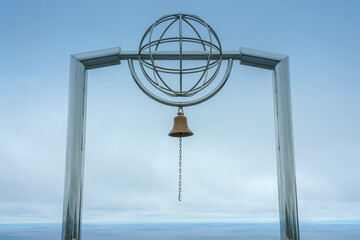 Muroran, Hokkaido, Japan - Oct 04 2024, Panoramic view of the Bell of happiness located in the observatory at Cape Chikyu with cloudy sky in the background, at daytime, Muroran, Japan