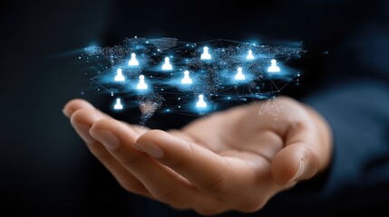 A business person extends their hand, holding a digital world map with glowing connection points, highlighting global links