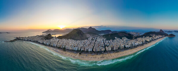 Wide Angle Horizontal Panorama of the Whole Copacabana Beach in Rio de Janeiro on Sunset With Mountains and Buildings
