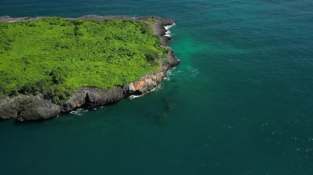 Remote drone perspective presenting Limon Island as an untouched natural landmark in open waters.